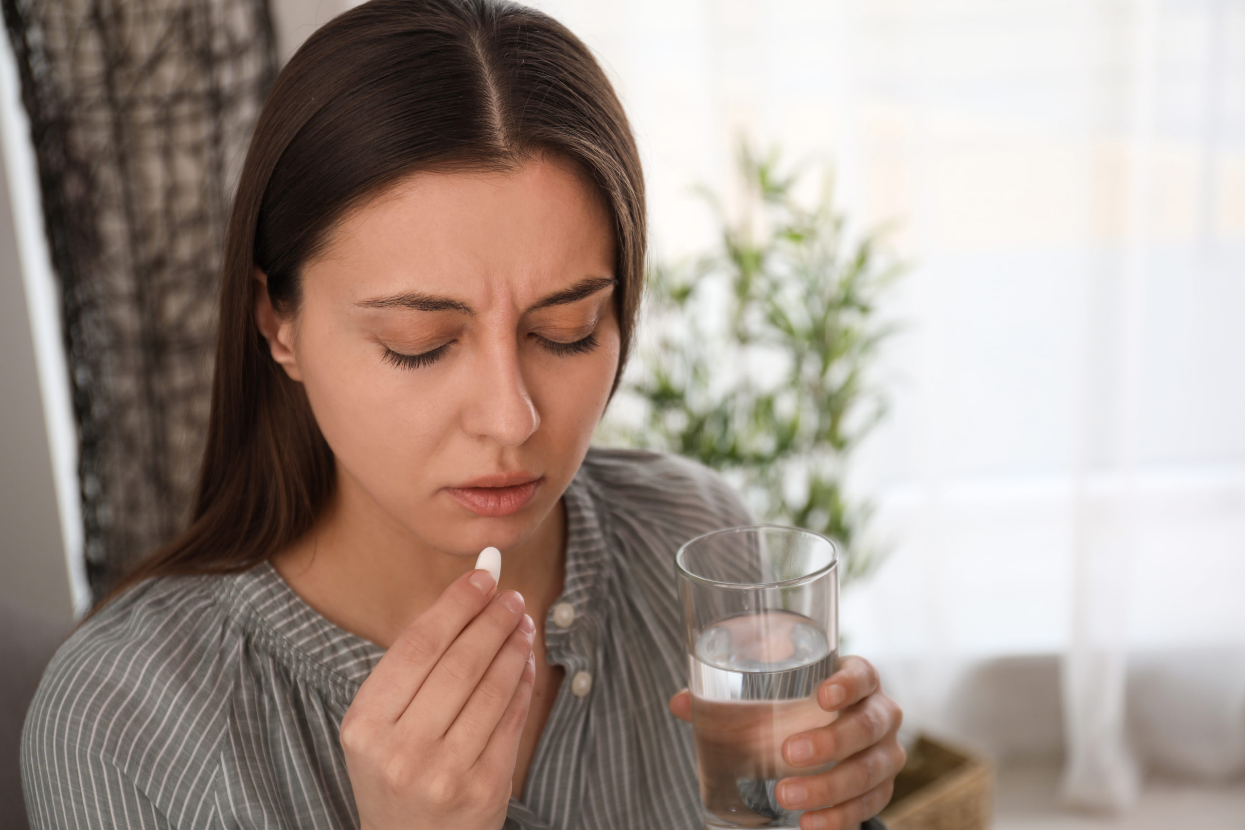 Woman taking medication